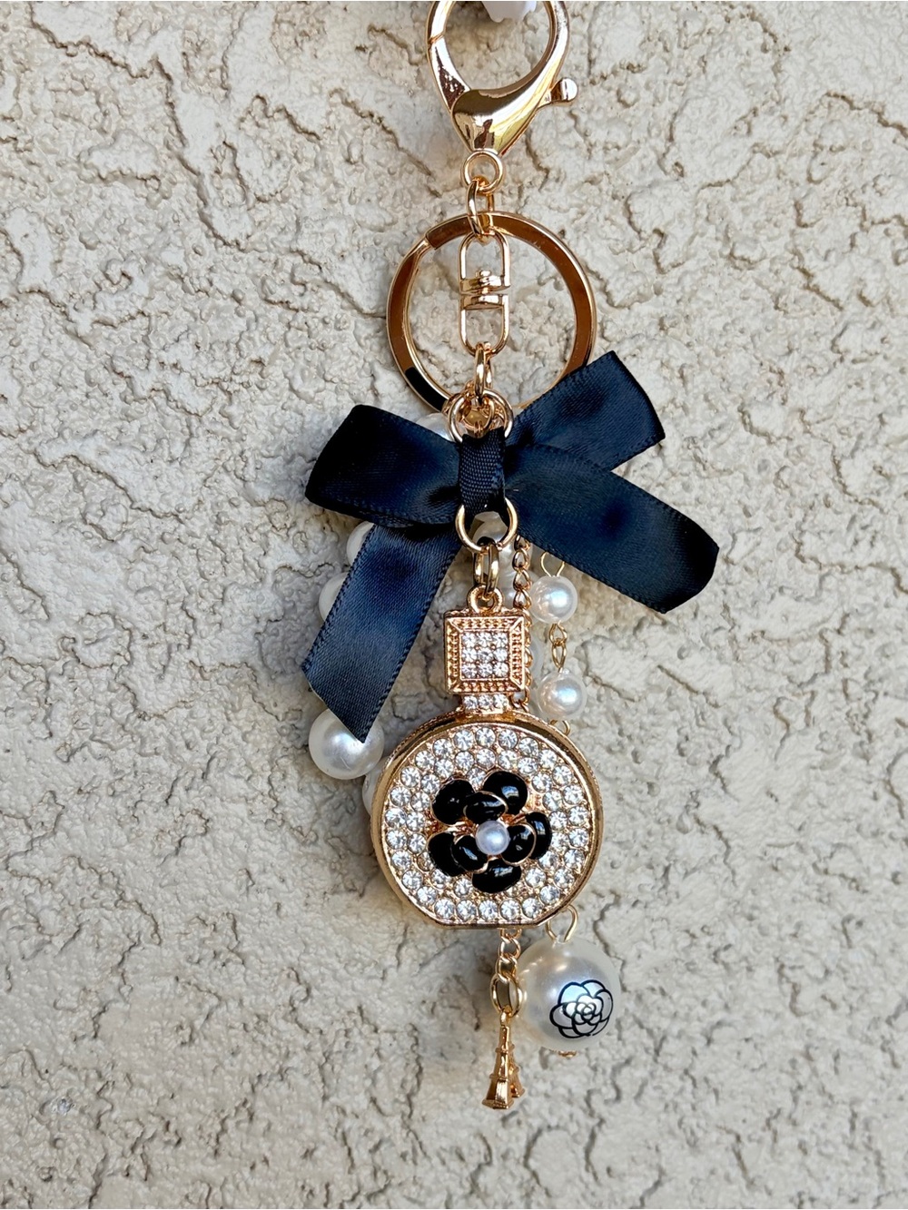 Luxe Gold & Rhinestone Perfume Bottle Ribbon & Pearl Accent Charm Keychain - Picture 2 of 8
